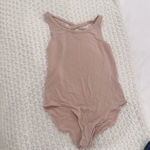 Stretchy pink crisscross body suit